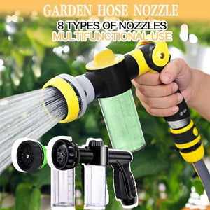 Garden hose nozzle with multiple nozzles and water spraying action, set against a garden background.
